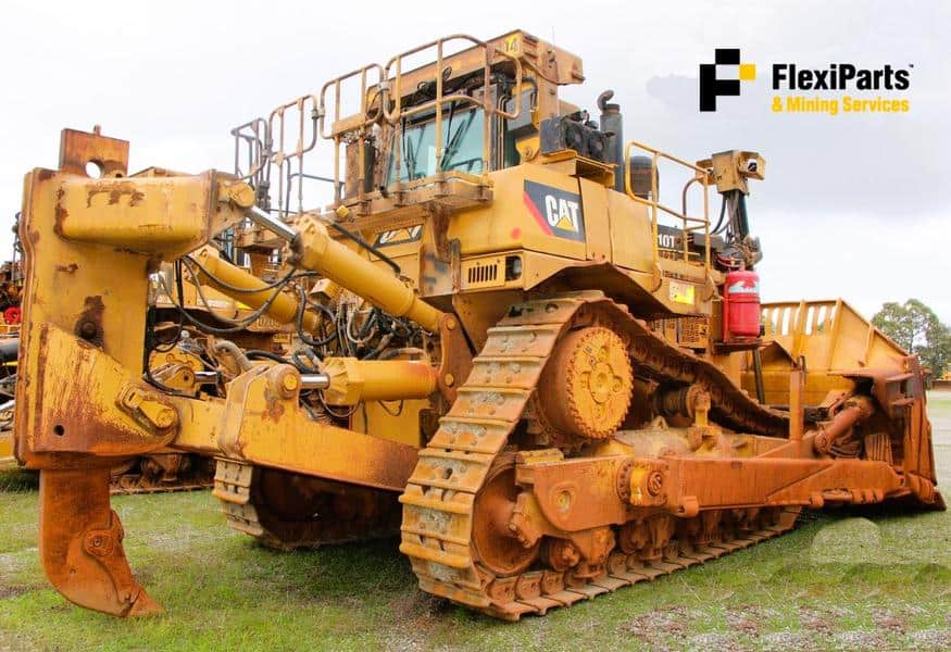 Cat 793C off-highway mining truck with rugged design and tracked undercarriage.