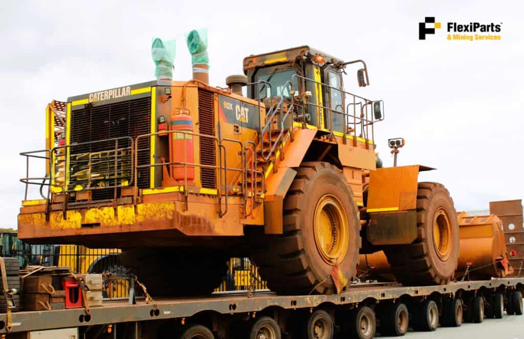 Cat 992K wheel loader with high lift arrangement for heavy-duty mining tasks.
